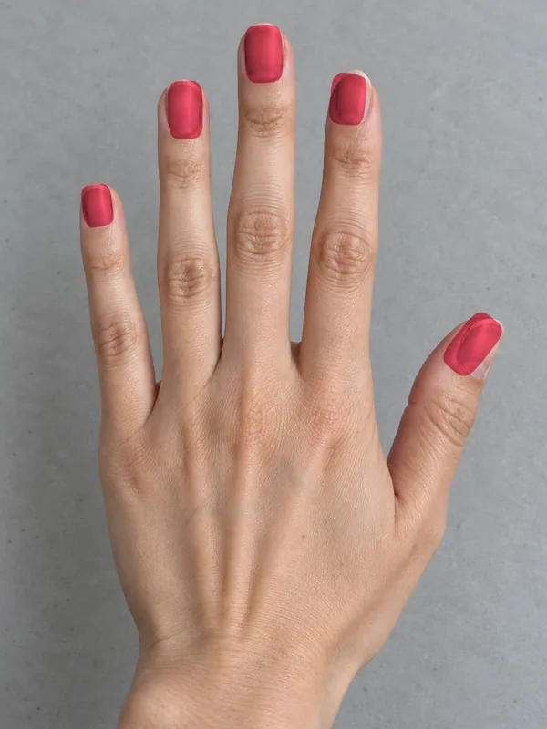 Demo hand with scarlet glossy polish applied in the ColourSesh studio