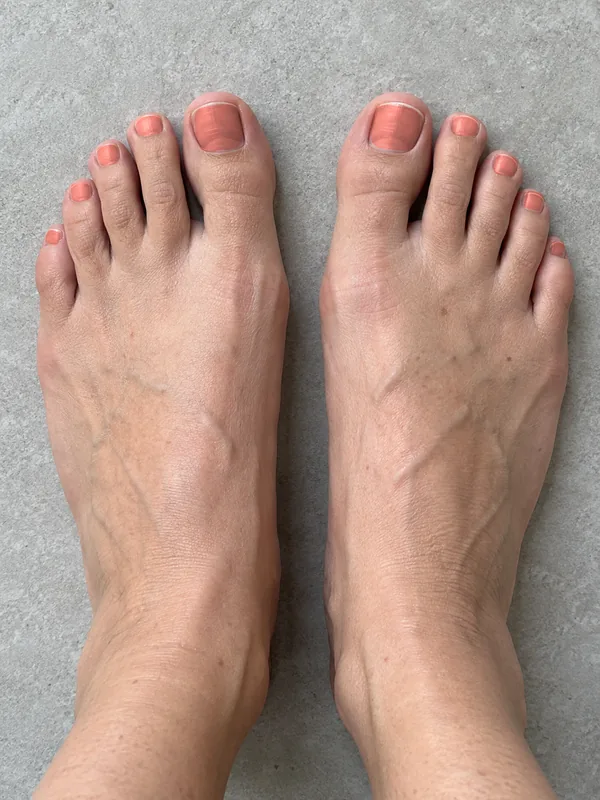 Demo feet with coral glossy polish applied in the ColourSesh studio